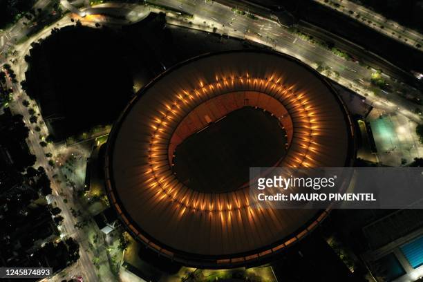 Maracana stadium is illuminated with a golden light in honour of Brazilian football legend Pele, in Rio de Janeiro, Brazil on December 29 on the day...