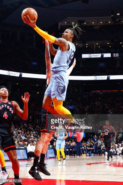 Ja Morant of the Memphis Grizzlies drives to the basket during the game against the Toronto Raptors on December 29, 2022 at the Scotiabank Arena in...