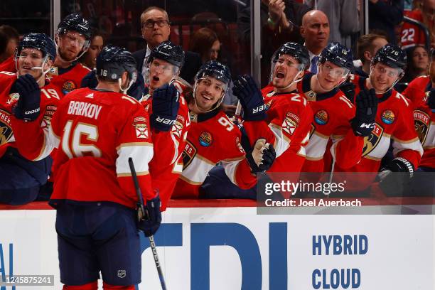 Teammates congratulate Aleksander Barkov of the Florida Panthers after he scored his third goal of the first period against the Montreal Canadiens at...