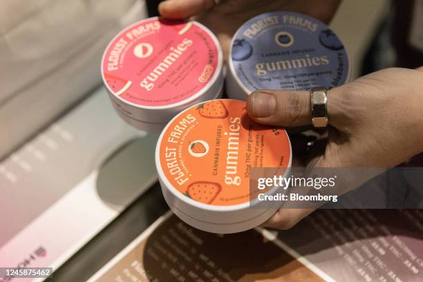 Staff holds Florist Farms cannabis products on the first day of legal recreational marijuana sales at the Housing Works Cannabis Co. In New York, US,...