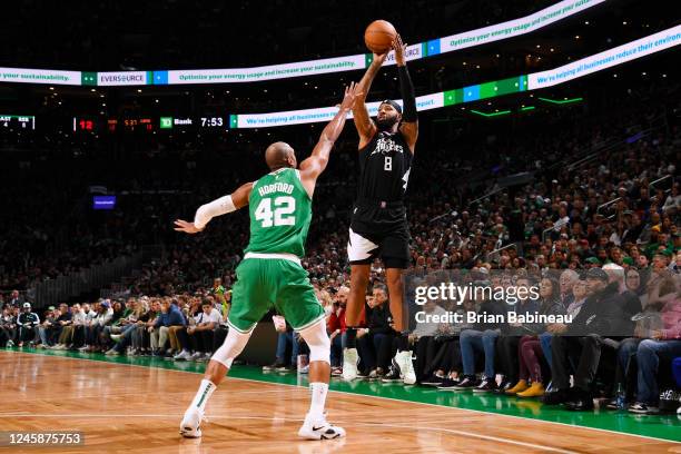 Marcus Morris Sr. #8 of the LA Clippers shoots a three point basket against the Boston Celtics on December 29, 2022 at the TD Garden in Boston,...