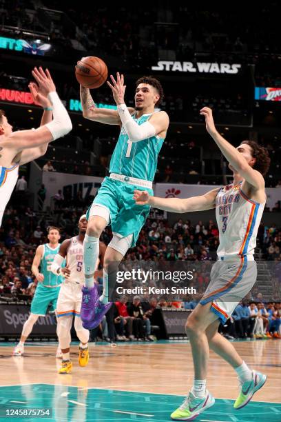 LaMelo Ball of the Charlotte Hornets goes to the basket against the Oklahoma City Thunder on December 29, 2022 at Spectrum Center in Charlotte, North...