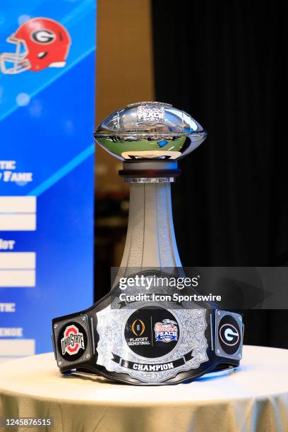 The Peach Bowl Trophy and the Battle for the Bowl Champions belt during the Battle for Bowl Week dinner between the University of Georgia Bulldogs...