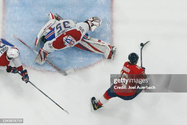 Aleksander Barkov of the Florida Panthers scores his second goal of the first period past goaltender Sam Montembeault of the Montreal Canadiens at...