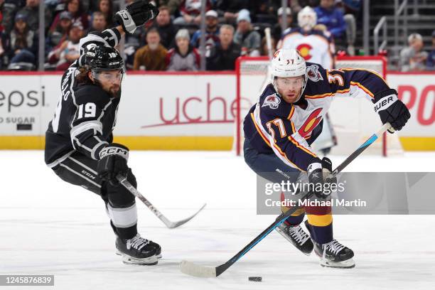 Compher of the Colorado Avalanche skates against Alex Iafallo of the Los Angeles Kings at Ball Arena on December 29, 2022 in Denver, Colorado.