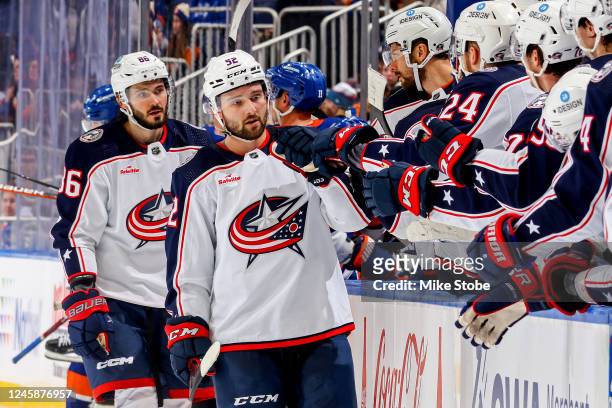 Emil Bemstrom of the Columbus Blue Jackets is congratulated by his teammates after scoring a goal against the New York Islanders during the third...