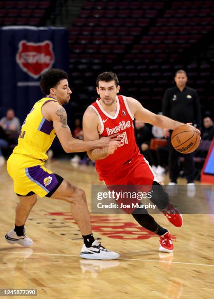 Dakota Mathias of the Memphis Hustle dribbles the ball against the South Bay Lakers during an NBA G-League game on December 29, 2022 at Landers...
