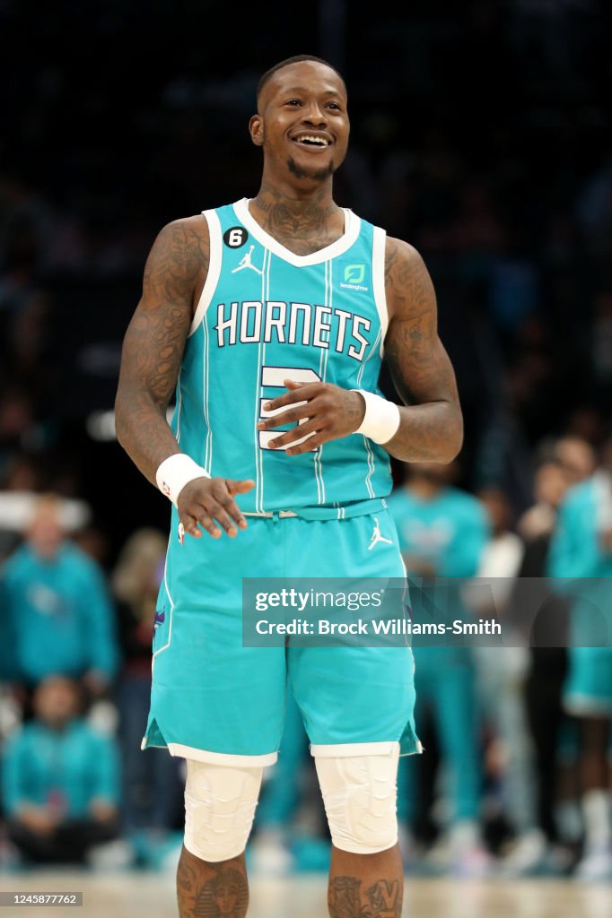 Terry Rozier of the Charlotte Hornets smiles during the game against ...
