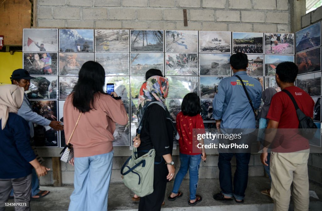 Merapi Volcano Museum Tourists observe a photos of the 2010 eruption of Mount Merapi which ...