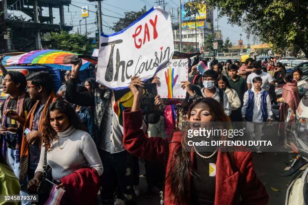 Members of the lesbian, gay, bisexual, transgender community shout slogans as they take part in a "Siliguri Pride Walk", in Siliguri on December 30,...