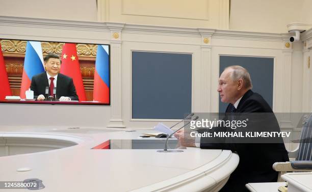 Russian President Vladimir Putin holds a meeting with Chinese President Xi Jinping via a video link at the Kremlin in Moscow on December 30, 2022. -...
