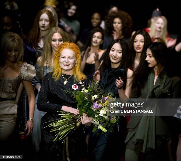 Designer Vivienne Westwood receives a bouquet after her Red Label collection fashion show, part of the Autumn/Winter 2009 collection, on the second...