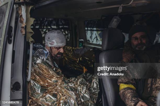 Ukrainian army medics treat a wounded Ukrainian soldier on the Donbass frontline, 29 December 2022.