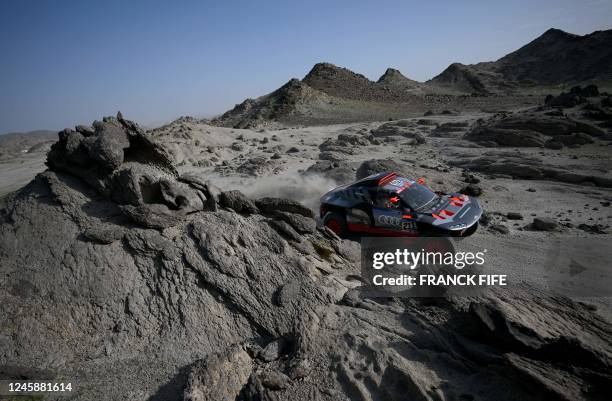 Swedish driver Mattias Ekstrom and his co-driver Emil Bergkvist of Sweeden ride during a training session by the Red Sea in Yanbu on December 30...