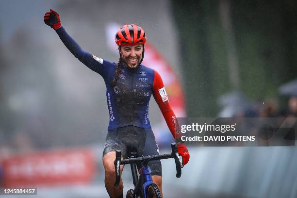 Dutch Shirin van Anrooij celebrates as he crosses the finish line to win the women's elite race of the cyclocross cycling event, race 6/8 during the...