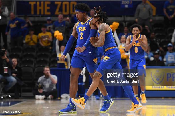 Blake Hinson of the Pittsburgh Panthers celebrates with Nike Sibande after a play in the second half during the game against the North Carolina Tar...