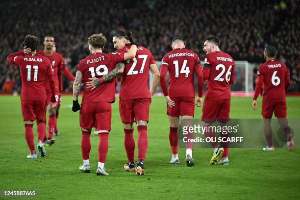 Liverpool's teammates celebrate the second owngoal scored by Leicester City's Belgian defender Wout Faes during the English Premier League football...