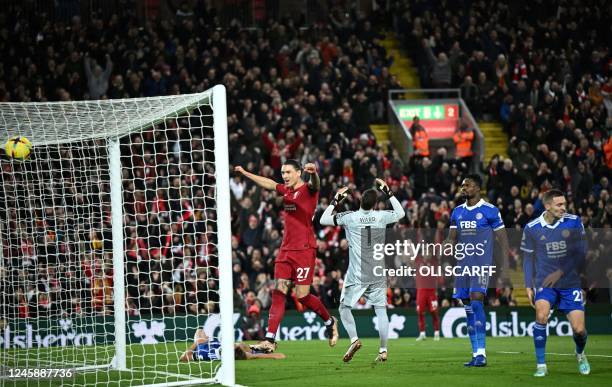 Liverpool's Uruguayan striker Darwin Nunez celebrates Leicester City's Belgian defender Wout Faes owngoal during the English Premier League football...