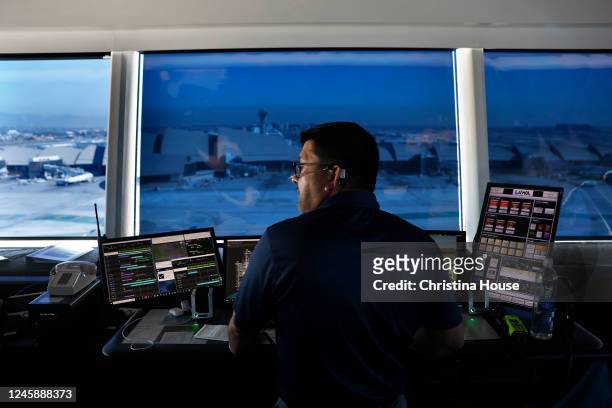 City employee Nelson Ceron works in the ramp traffic control tower at the new West Gates at Tom Bradley International Terminal at LAX on Wednesday,...