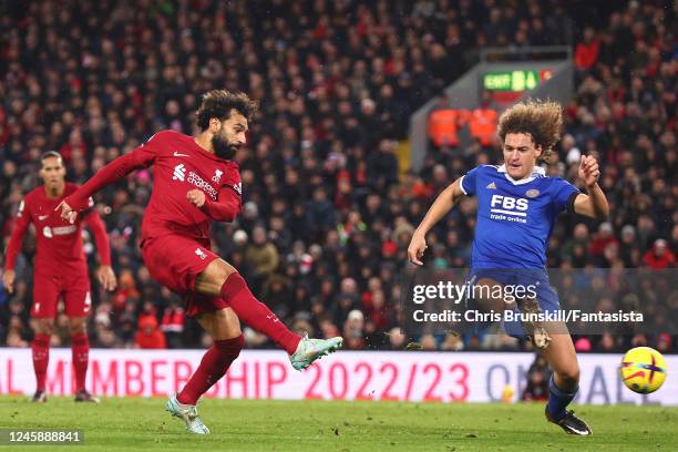 Mohamed Salah of Liverpool shoots under pressure from Wout Faes of Leicester Cityduring the Premier League match between Liverpool FC and Leicester...