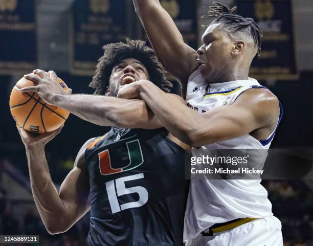 Norchad Omier of the Miami Hurricanes shoots the ball against Ven-Allen Lubin of the Notre Dame Fighting Irish during the second half at Joyce Center...