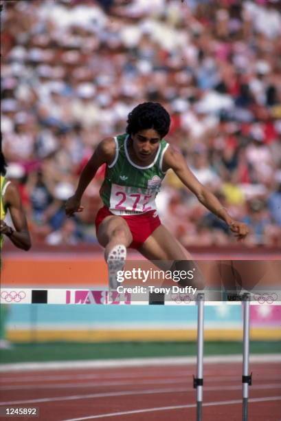 Nawal El Moutawakel of Morocco clears a hurdle during the inaugural Women's 400 metres hurdles event at the XXIII Olympic Summer Games on 8th August...