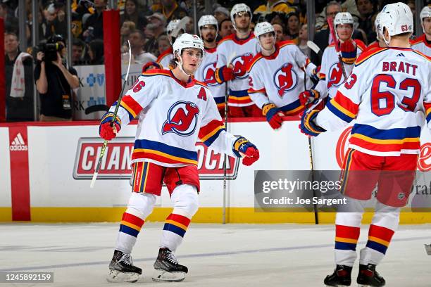 Jack Hughes of the New Jersey Devils celebrates his second period goal against the Pittsburgh Penguins at PPG PAINTS Arena on December 30, 2022 in...