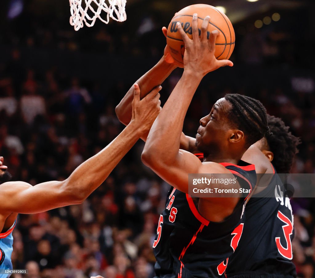 Toronto Raptors Centre Toronto Raptors center Christian Koloko is fouled as he goes to the ...