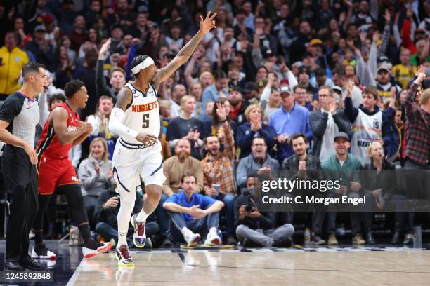 Kentavious Caldwell-Pope of the Denver Nuggets celebrates a three point basket against the Miami Heat during the first quarter at Ball Arena on...