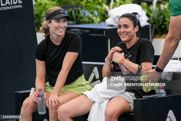 American tennis player Danielle Collins laughs with Ons Jabeur from Tunisia during a practice session ahead of the WTA Adelaide International...