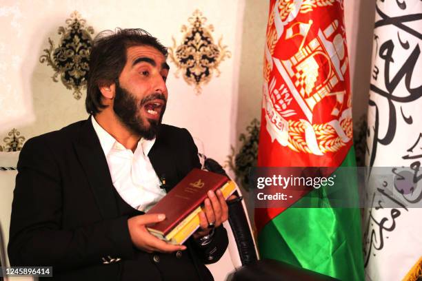 In this picture taken on December 30 Ismail Mashal, a lecturer of journalism at three universities, speaks during an interview with AFP in Kabul. -...