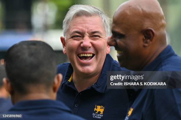 Sri Lanka's coach Chris Silverwood gestures before leaving for a tour of India from the Sri Lanka Cricket headquarters in Colombo on December 31,...