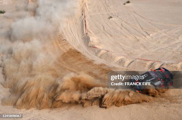 Swedish driver Mattias Ekstrom, with his co-driver Emil Bergkvist of Sweeden, steers his Audi's Hybrid during the prologue of the Dakar 2023 by the...