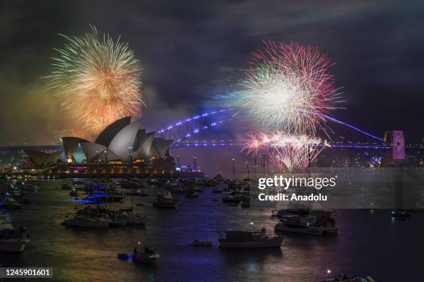 The fireworks are seen over the Sydney Opera House and Sydney Harbour Bridge during New Yearâs Eve celebrations in Sydney, Australia, on Sunday,...