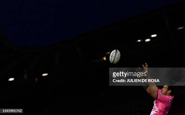Stade Francais' French flanker Romain Briatte wins the line-out during the French Top14 rugby union match between Stade Francais Paris and Section...