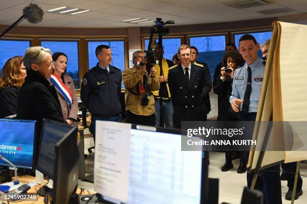 French Prime Minister Elisabeth Borne listens as she attends to the presentation of the gendarmerie force dedicated to New Year's Eve in Argenteuil...