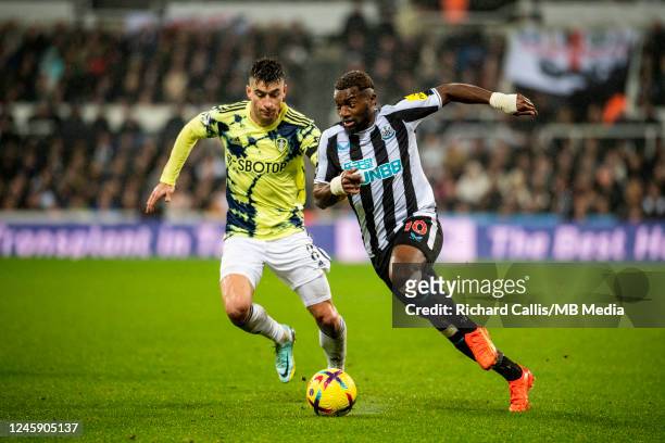 Allan Saint-Maximin of Newcastle United and and Marc Roca of Leeds in action during the Premier League match between Newcastle United and Leeds...