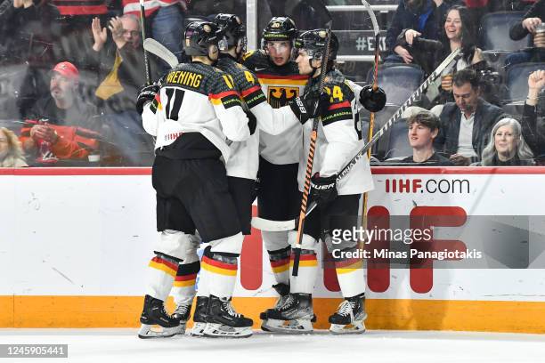 Veit Oswald of Team Germany celebrates his goal with teammates Philipp Krening, Philip Sinn and Roman Kechter during the second period against Team...