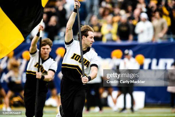 Iowa Hawkeyes cheerleaders celebrate a touchdown against the Kentucky Wildcats during the TransPerfect Music City Bowl at Nissan Stadium on December...