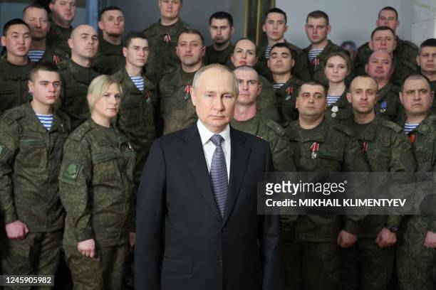 Russian President Vladimir Putin poses as he delivers a New Year's address to the nation at the headquarters of the Southern Military District in...