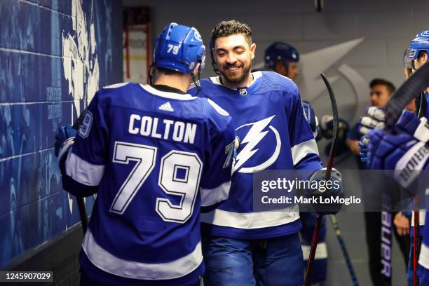 Ross Colton and Nicholas Paul of the Tampa Bay Lightning get ready for the game against the Arizona Coyotes at Amalie Arena on December 31, 2022 in...