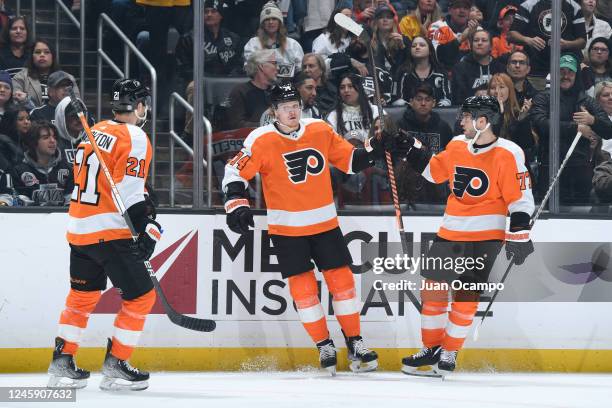 Owen Tippett of the Philadelphia Flyers celebrates his goal with teammates Scott Laughton and Tony DeAngelo during the second period against the Los...