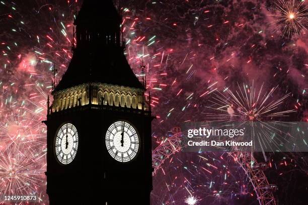 Fireworks light up the London skyline over Big Ben and the London Eye just after midnight on January 1, 2023 in London, England. London's New Years'...