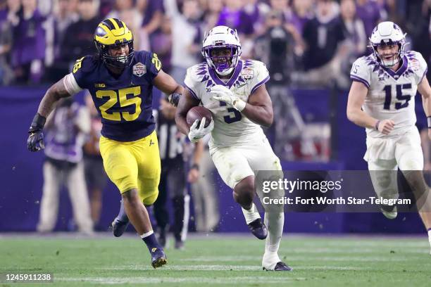 Running back Emari Demercado runs for 69 yards to set up a touchdown in the next play against Michigan in the Vrbo Fiesta Bowl at State Farm Stadium...