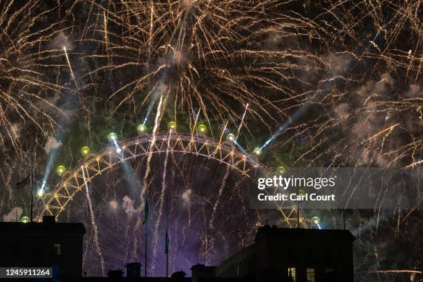 Fireworks light up the London skyline over the London Eye to celebrate the New Year on January 1, 2023 in London, England. London's New Years' Eve...