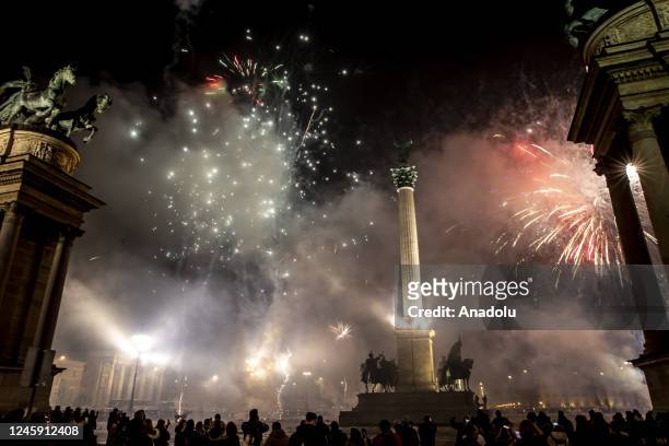 Fireworks light up the night sky over Heroes Square within the new year celebrations in Budapest, Hungary on January 01, 2023.