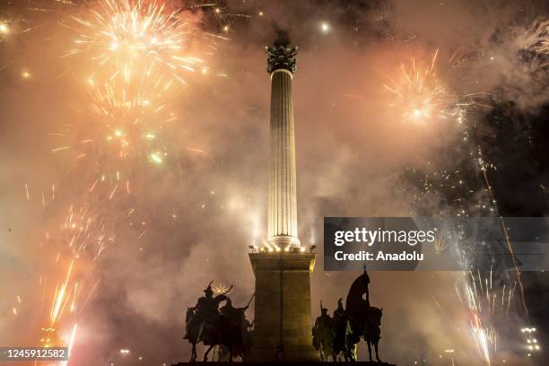 Fireworks light up the night sky over Heroes Square within the new year celebrations in Budapest, Hungary on January 01, 2023.