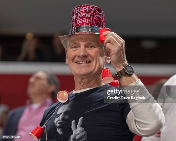 Fan celebrates New Years Eve during the third period of an NHL game between the Detroit Red Wings and the Ottawa Senators at Little Caesars Arena on...