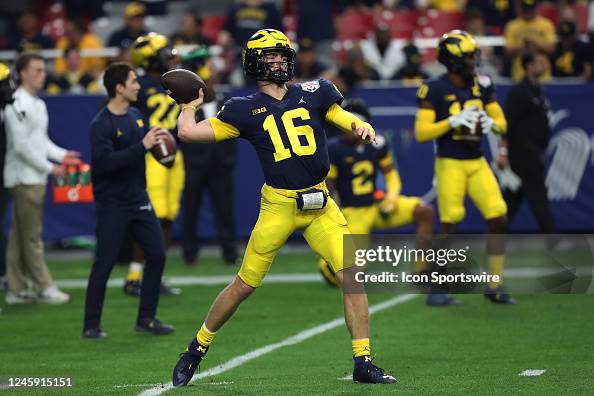 Michigan Wolverines Quarterback Davis Warren warms up before the Vrbo ...