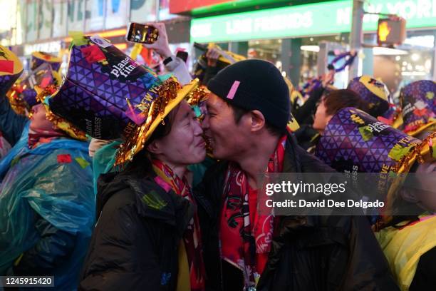 Couple kisses at Times Square during New Year celebrations on January 1, 2023 in New York City. Revelers return to a full scale event after two years...